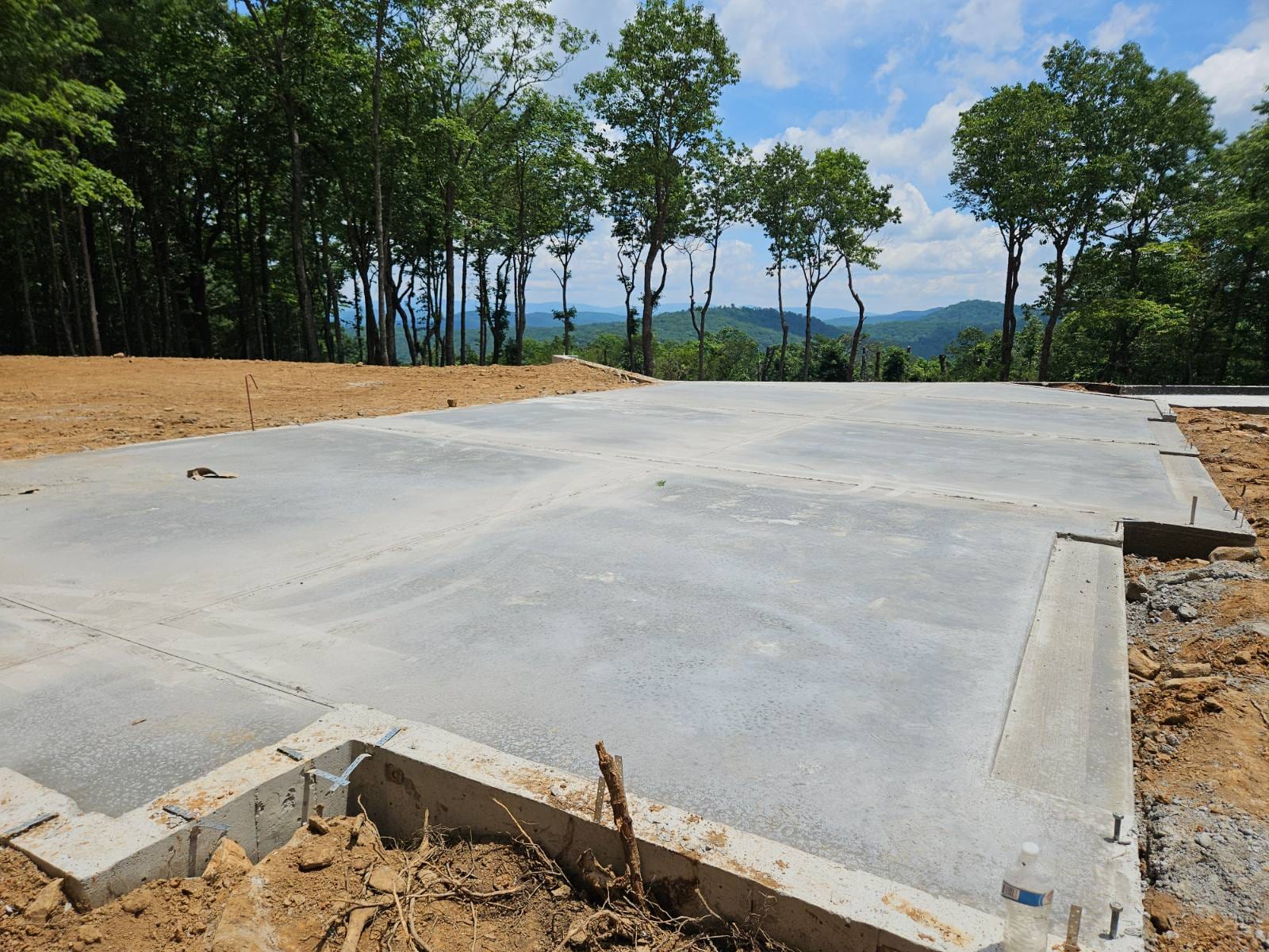 Completed concrete foundation with a mountain view