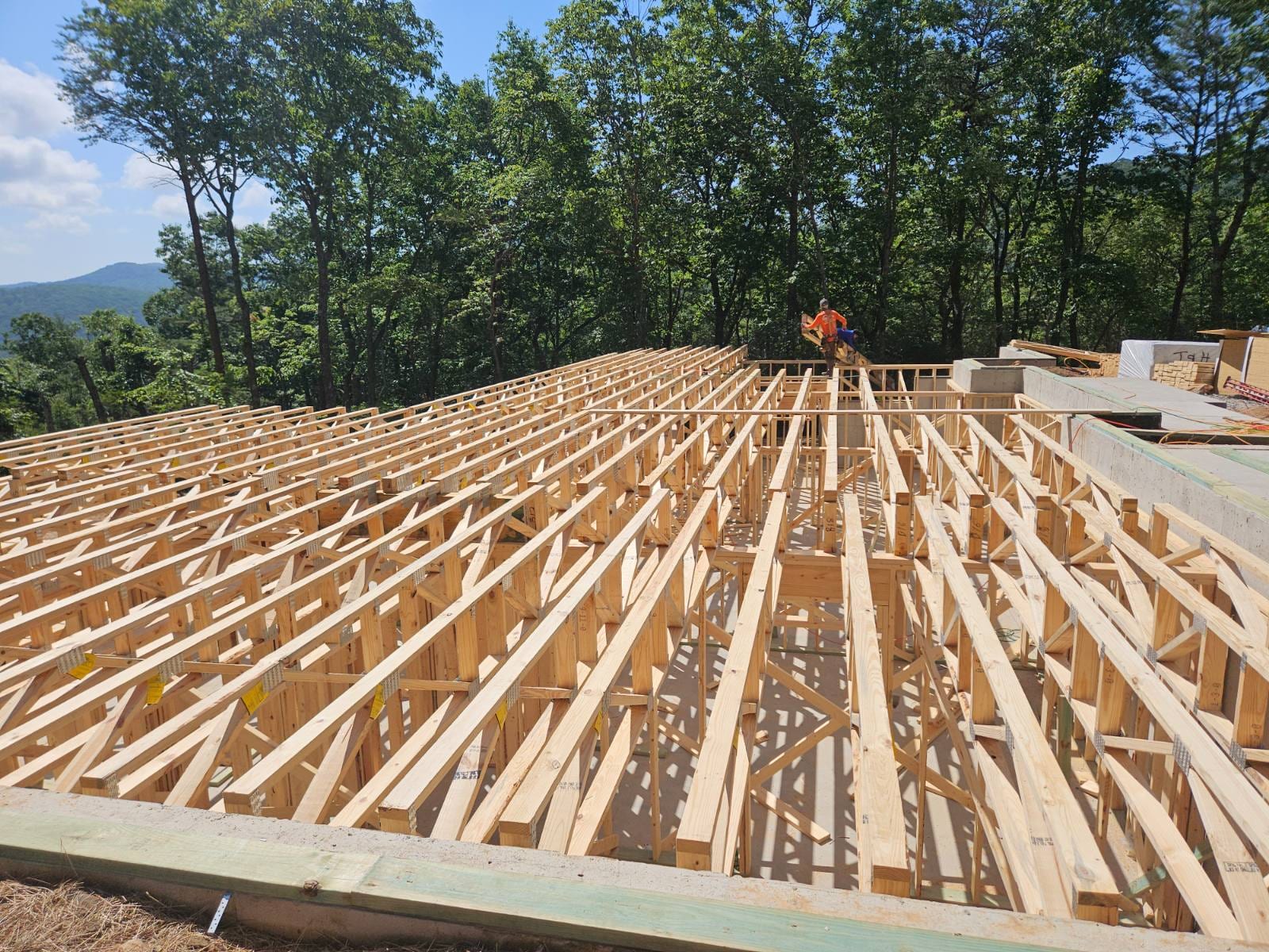 Close-up of floor trusses set across the framing