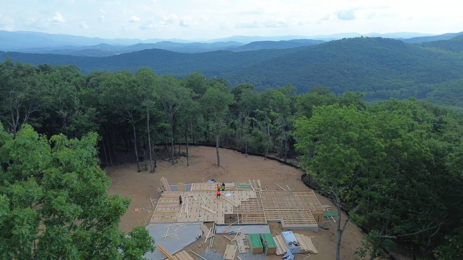 Aerial view of the home framing with a Blue Ridge mountain backdrop